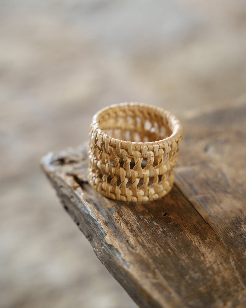 Woven basket on a rustic wooden surface with a blurred background